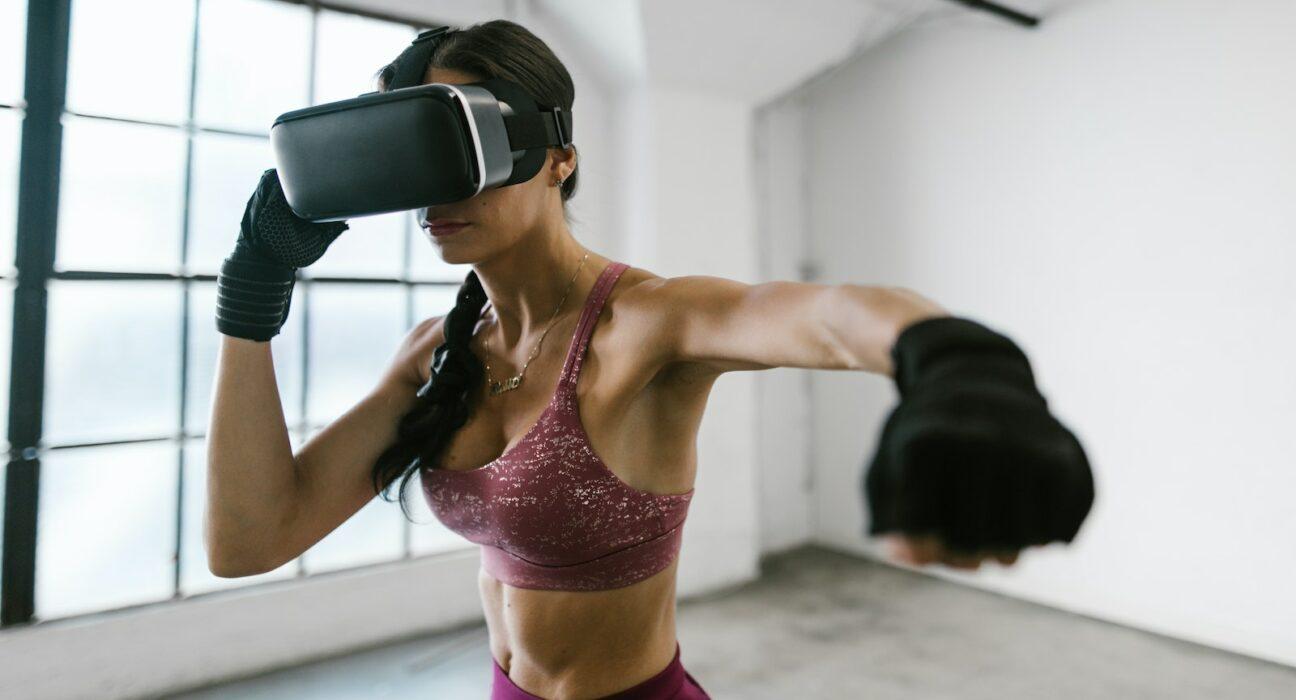 A person immersed in a virtual reality workout surrounded by digital elements