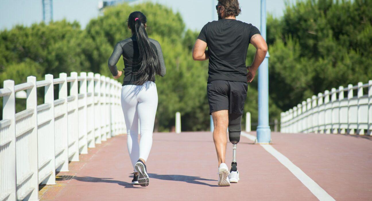 Man and woman jogging outdoors in a park