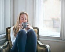 Woman Holding Gray Ceramic Mug